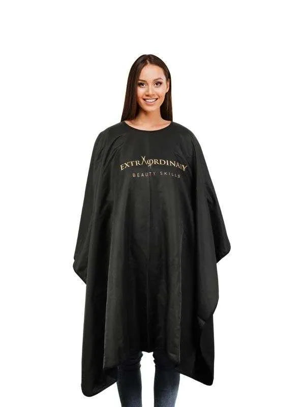 Cosmetic Cape 'EXTRAORDINARY BEAUTY SKILLS' in black microfiber, providing full coverage for beauty treatments.